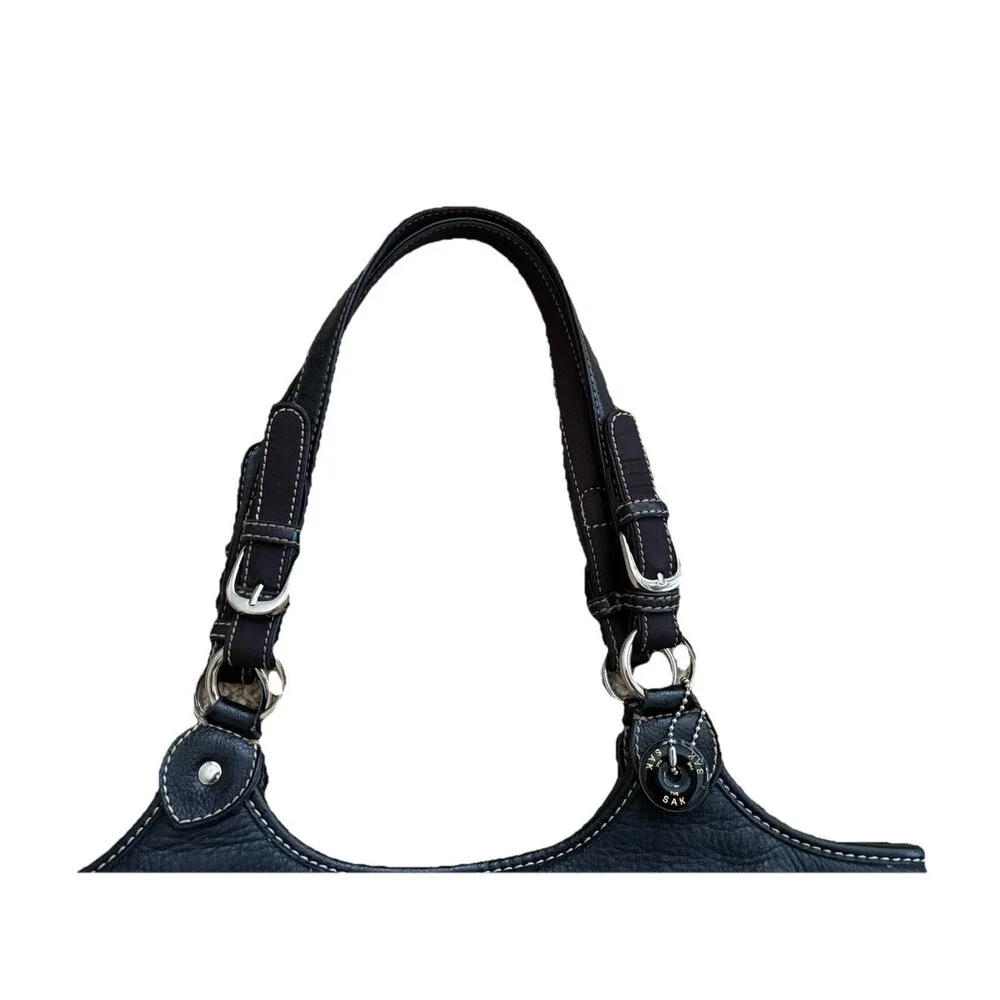 The Sak Black Pebbled Leather Shoulder Bag Buckles Silver Hardware Stitching